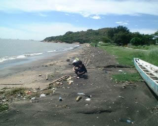 Collecting plastic resin pellets on Hong Kong beach